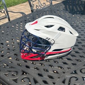 White Lacrosse Helmet with Red and Blue Cage